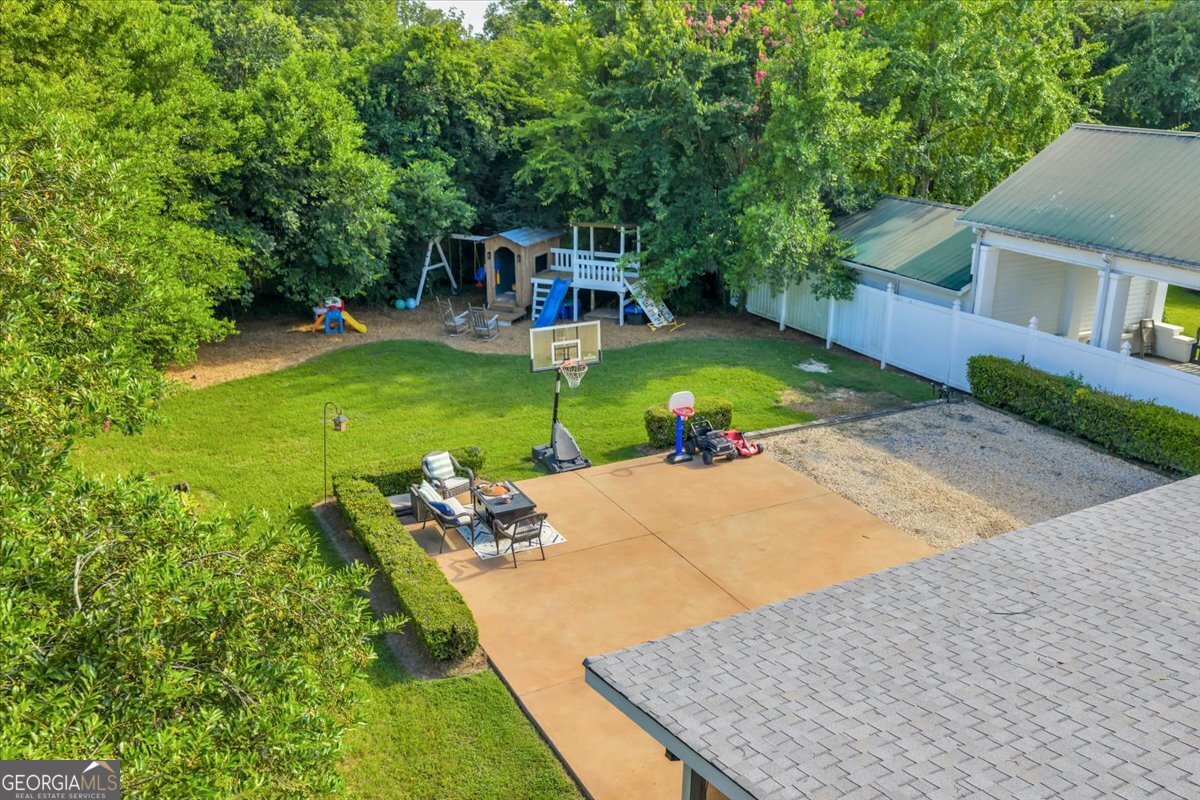 712 Stonewall Street Dublin, GA 31021 - Photo 59 of 65 swimming pool view with a seating space and a garden