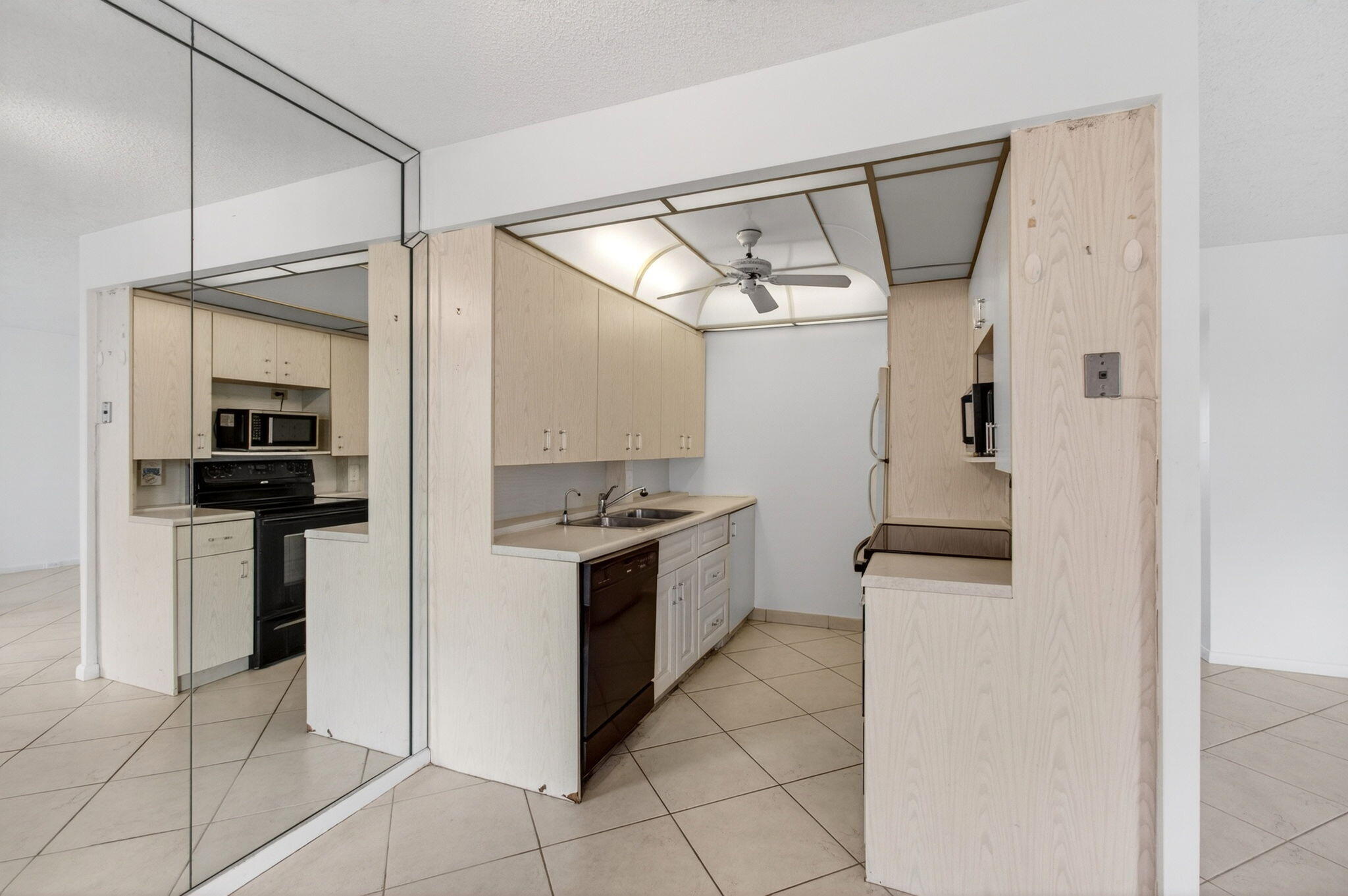 2027 Exeter Boca Raton, FL 33434 - Photo 20 of 100 a kitchen with granite countertop a refrigerator and a stove top oven