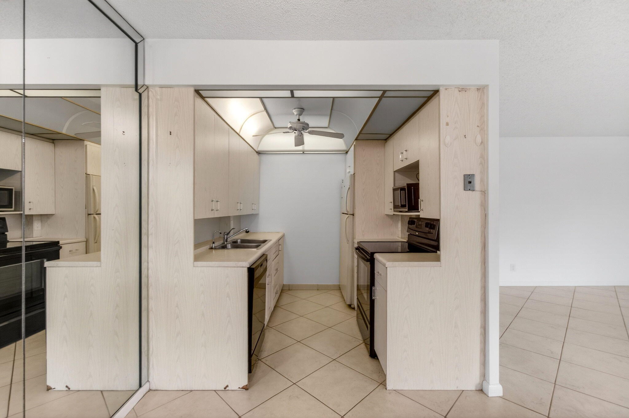 2027 Exeter Boca Raton, FL 33434 - Photo 21 of 100 a kitchen with stainless steel appliances a refrigerator and a stove