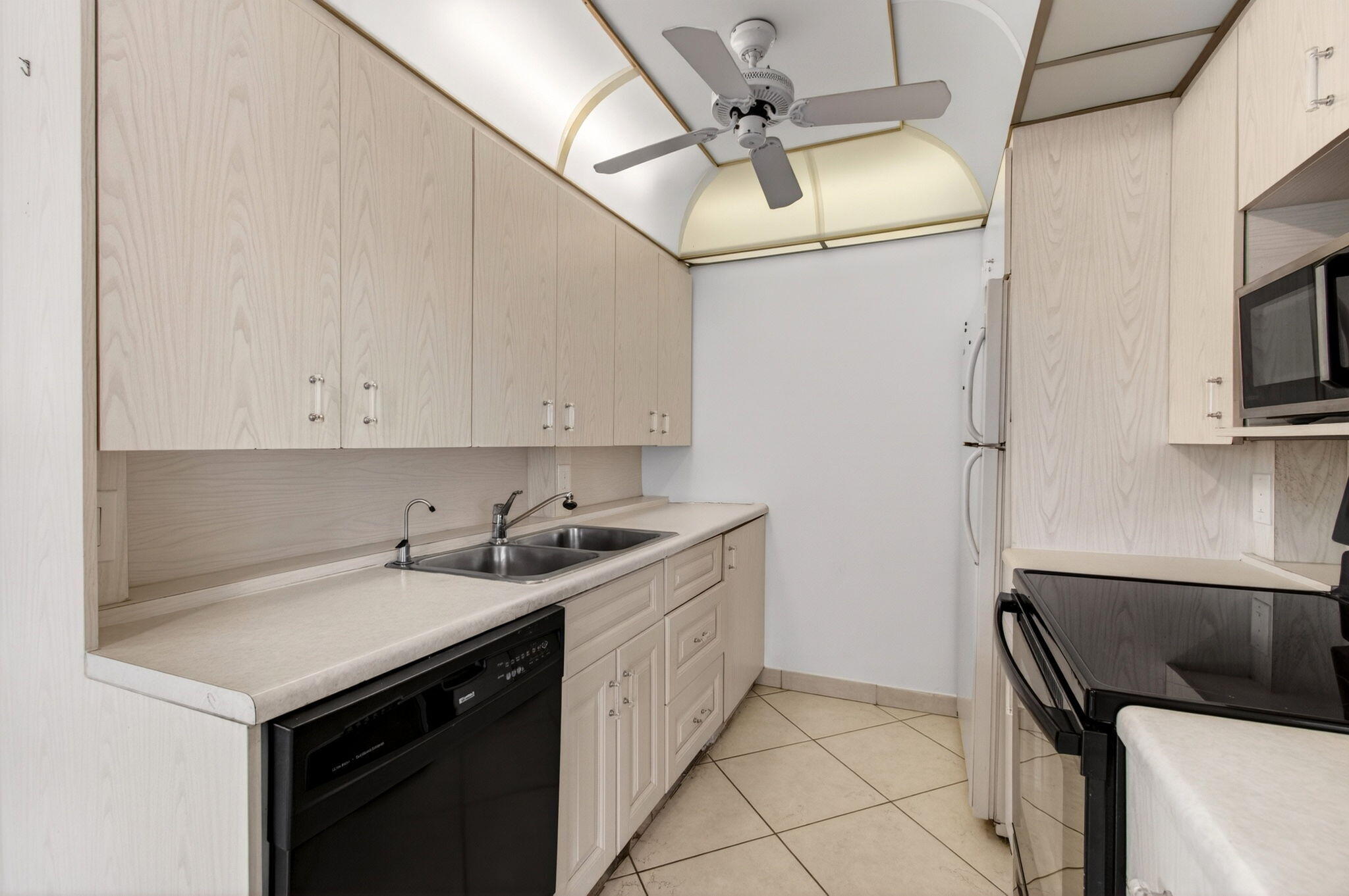 2027 Exeter Boca Raton, FL 33434 - Photo 23 of 100 a kitchen with a sink cabinets and appliances
