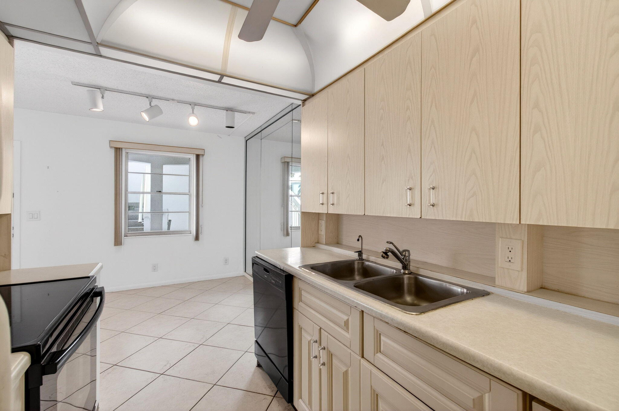 2027 Exeter Boca Raton, FL 33434 - Photo 27 of 100 a kitchen with a sink cabinets and window