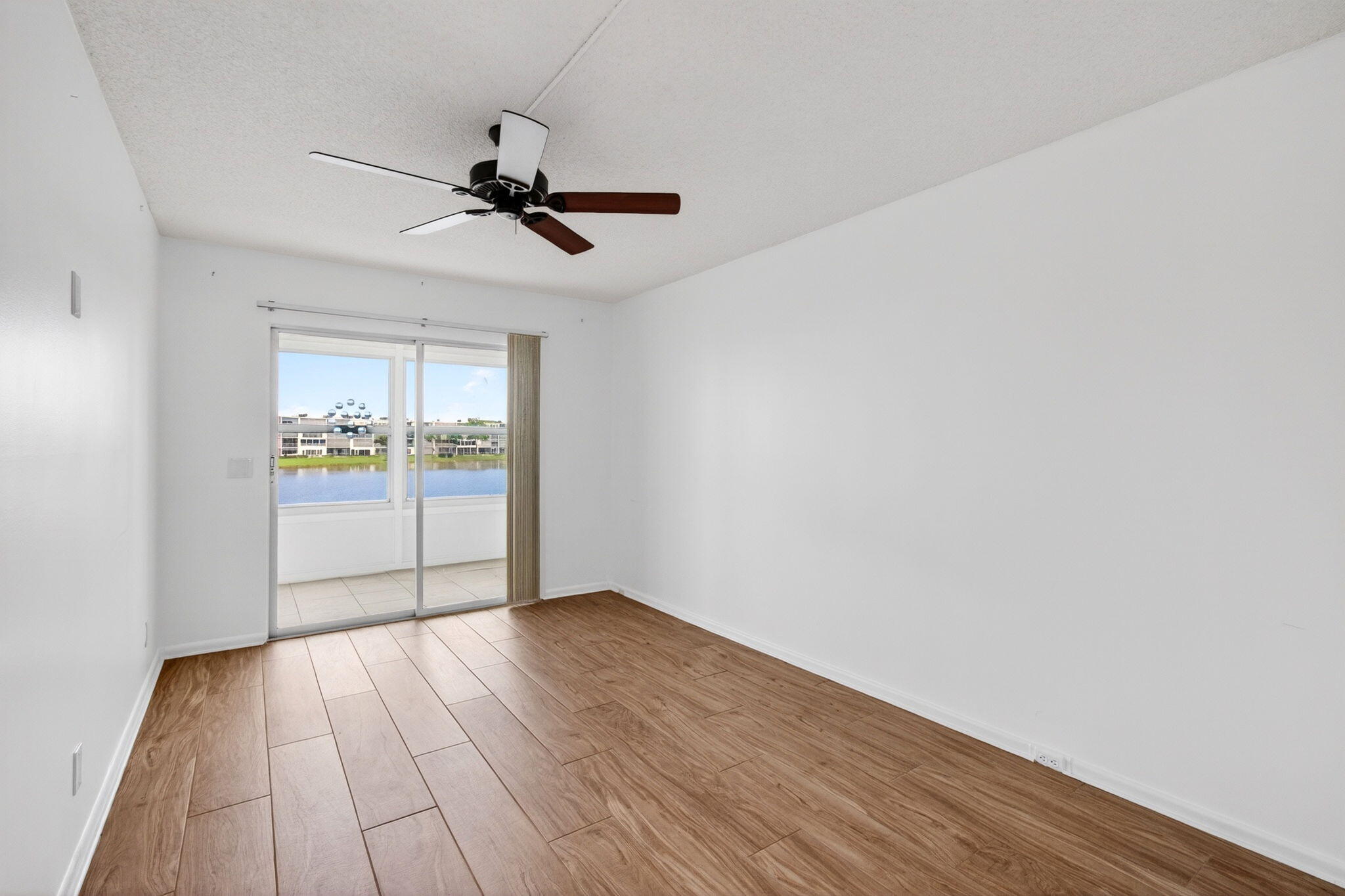 2027 Exeter Boca Raton, FL 33434 - Photo 40 of 100 wooden floor in an empty room with a window