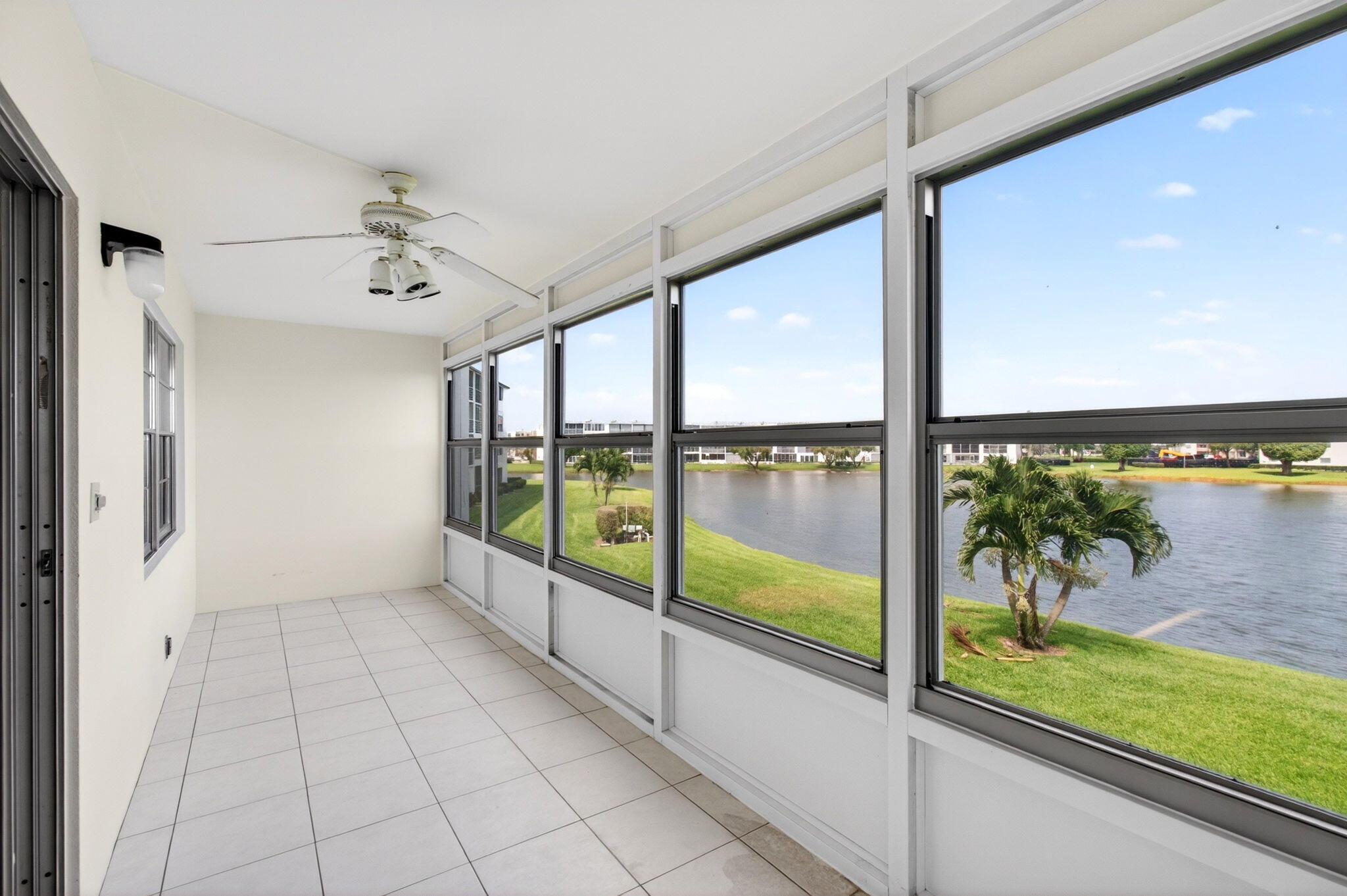 2027 Exeter Boca Raton, FL 33434 - Photo 44 of 100 a view of an entryway with a floor to ceiling window