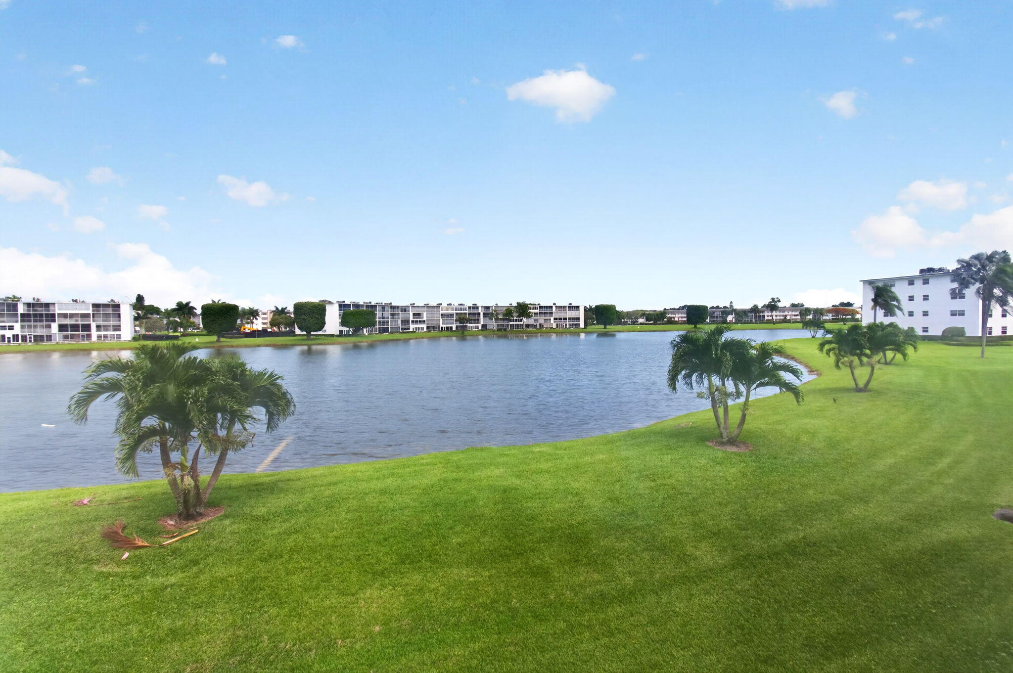2027 Exeter Boca Raton, FL 33434 - Photo 49 of 100 a view of a lake with a city