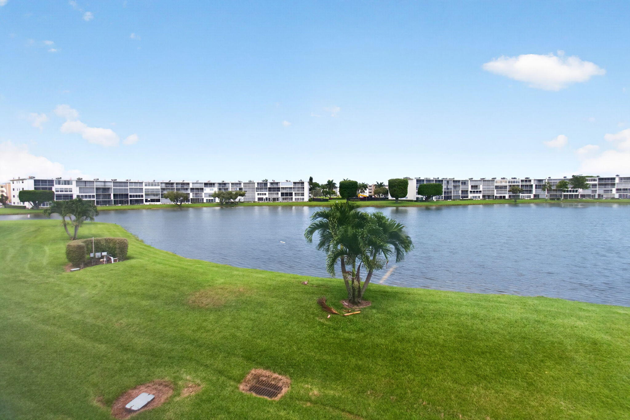 2027 Exeter Boca Raton, FL 33434 - Photo 50 of 100 a view of a lake with a city