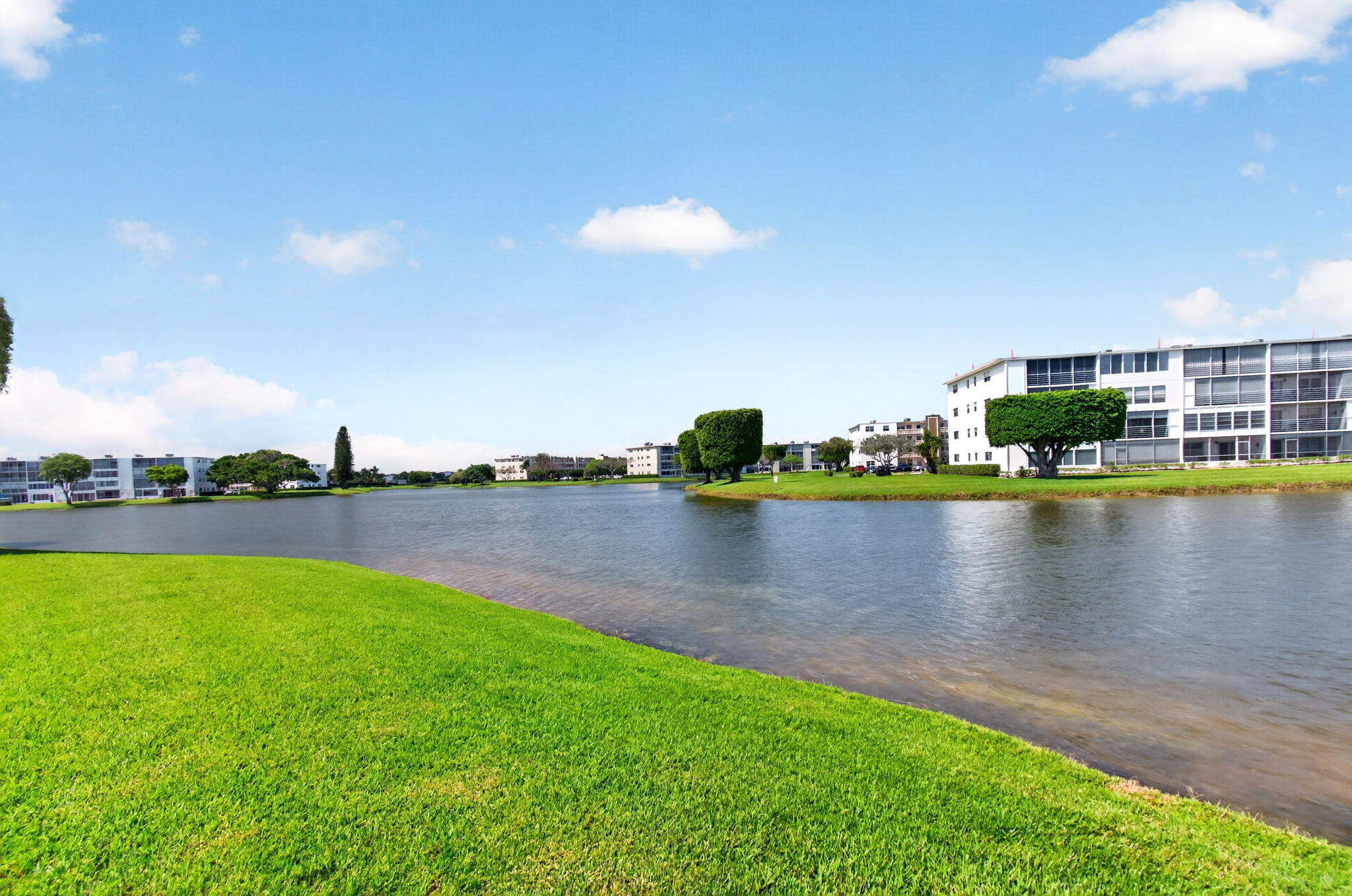 2027 Exeter Boca Raton, FL 33434 - Photo 53 of 100 a view of a lake with houses in the back