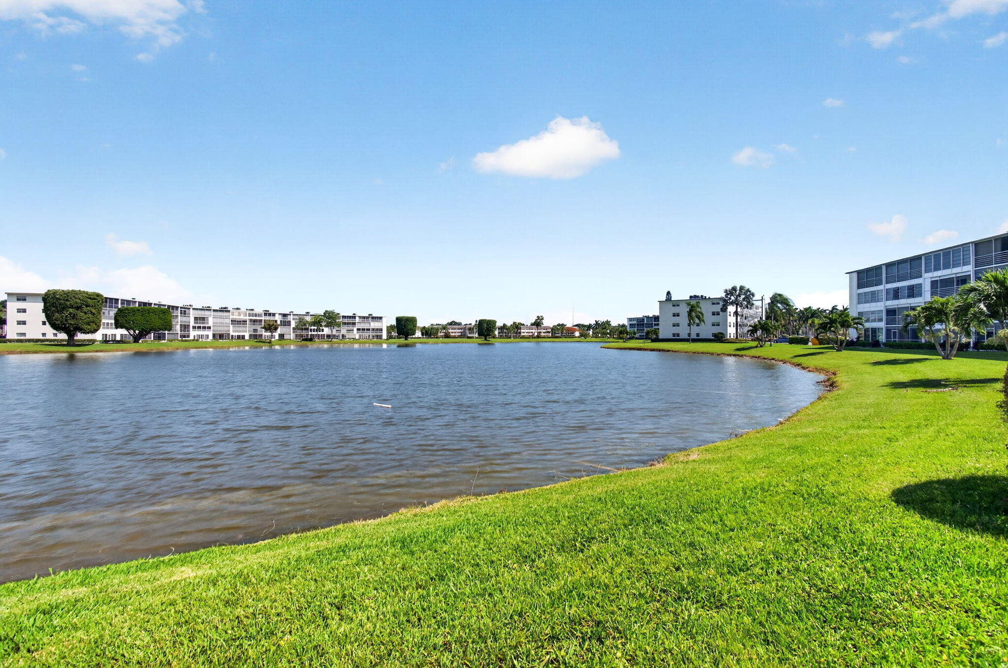 2027 Exeter Boca Raton, FL 33434 - Photo 59 of 100 a view of a lake with houses in the back