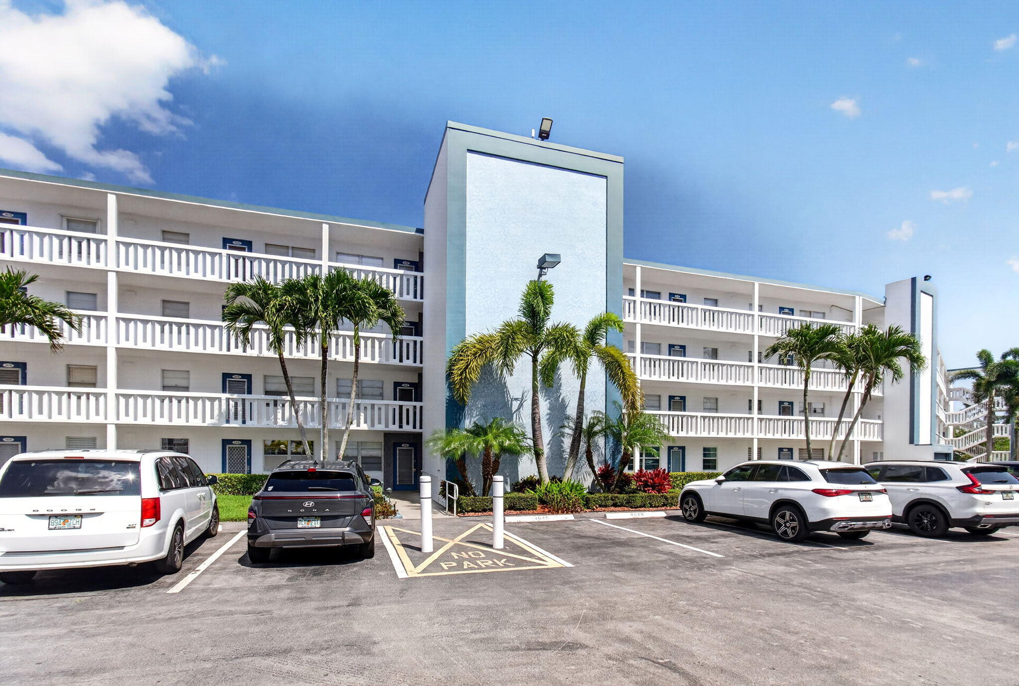 2027 Exeter Boca Raton, FL 33434 - Photo 65 of 100 a view of parking with cars parked in front of a building