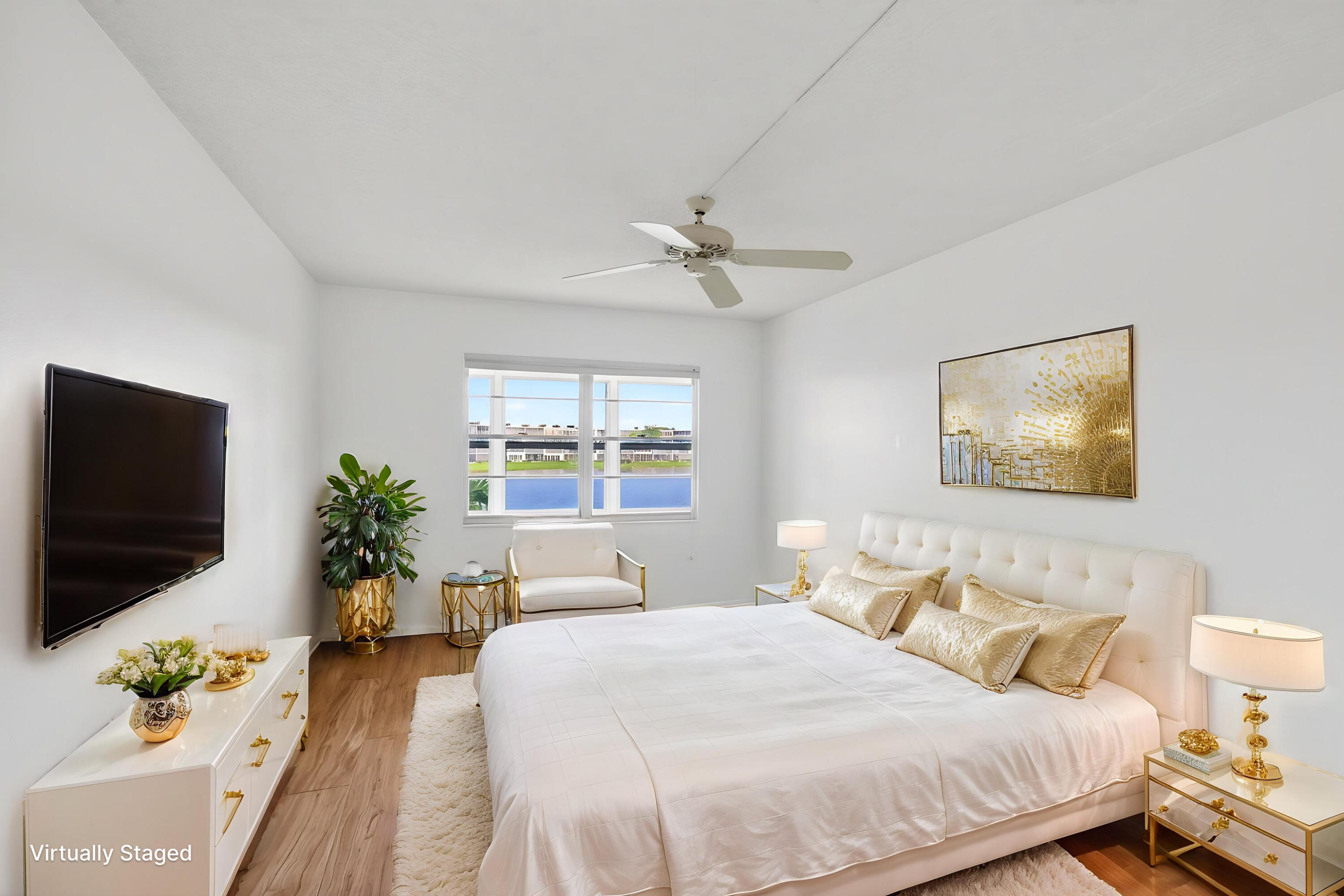 2027 Exeter Boca Raton, FL 33434 - Photo 7 of 100 a bedroom with a bed and a flat screen tv