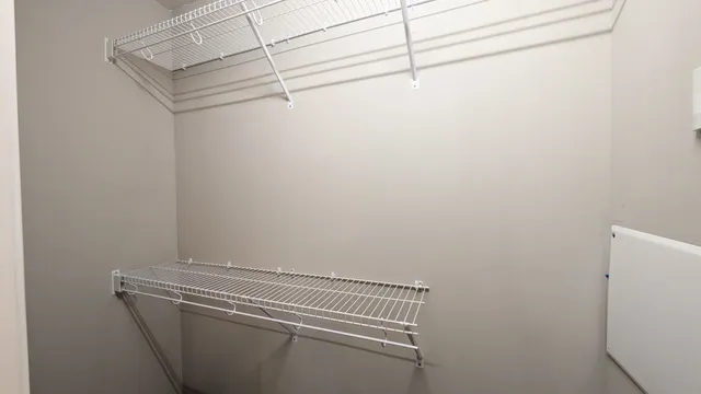 a view of a room with racks on the wall