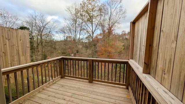 a view of balcony with wooden floor