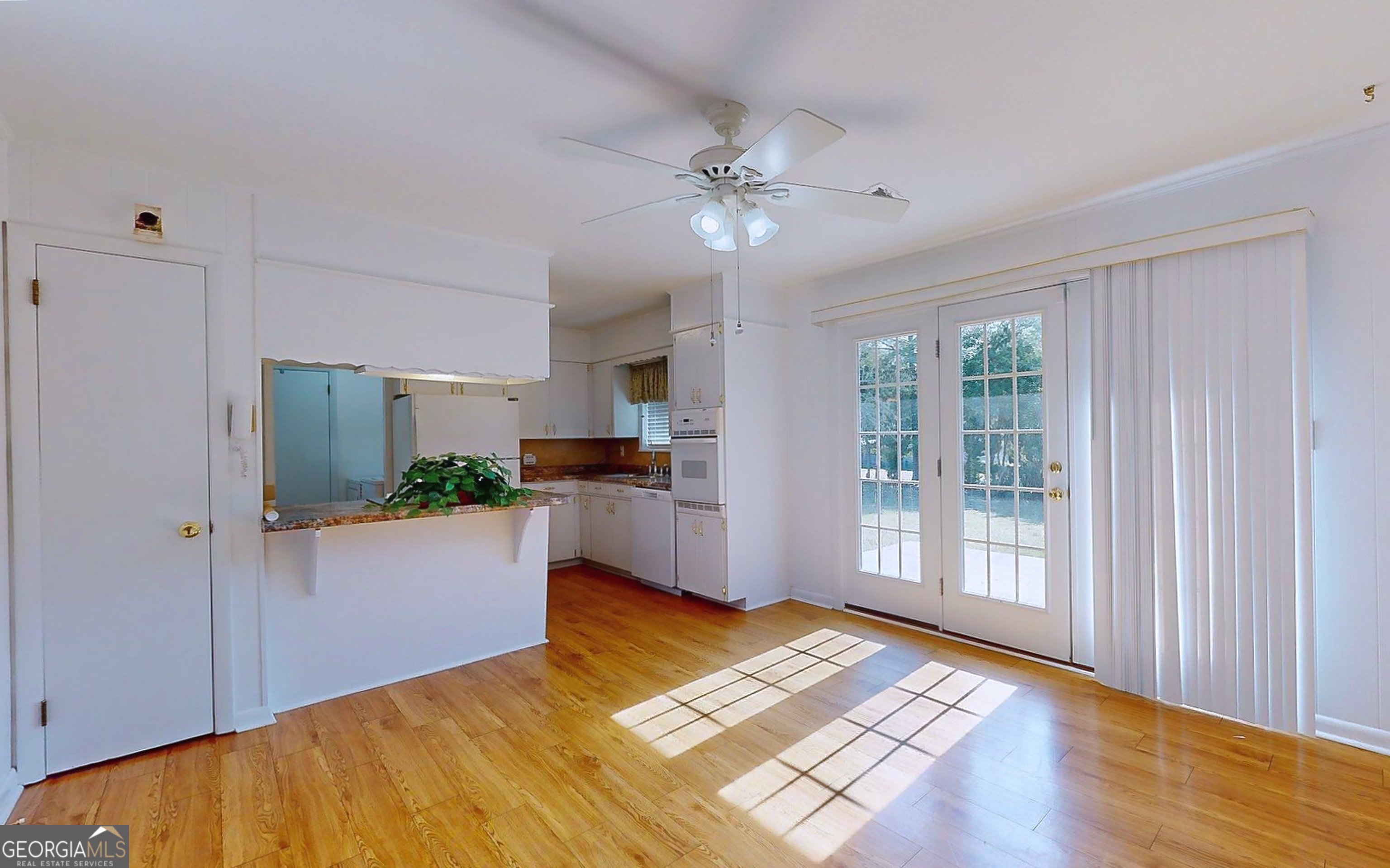104 Azalea Lane Reidsville, GA 30453 - Photo 19 of 50 a view of a kitchen with wooden floor and a kitchen