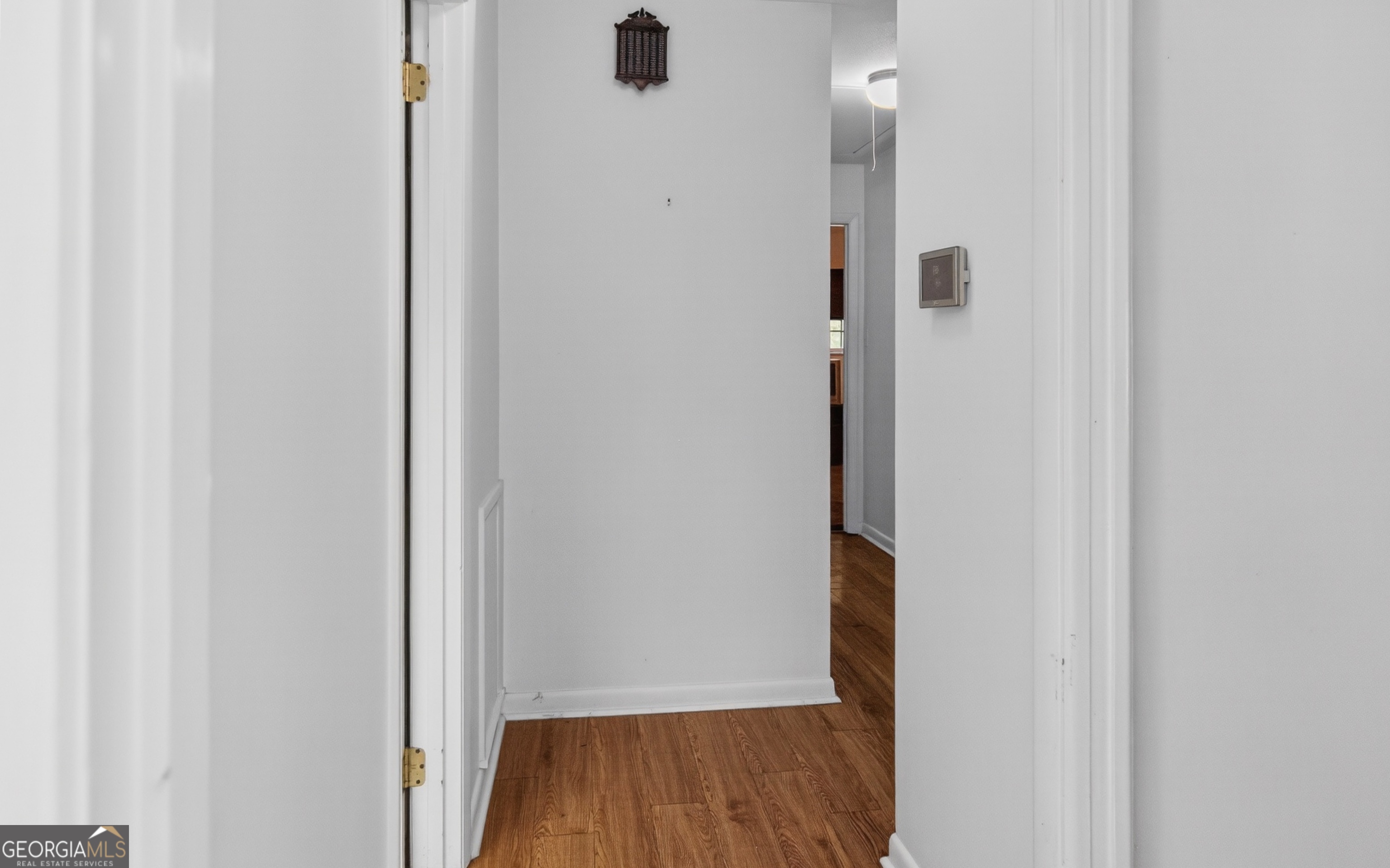 104 Azalea Lane Reidsville, GA 30453 - Photo 21 of 50 a view of a hallway with wooden floor
