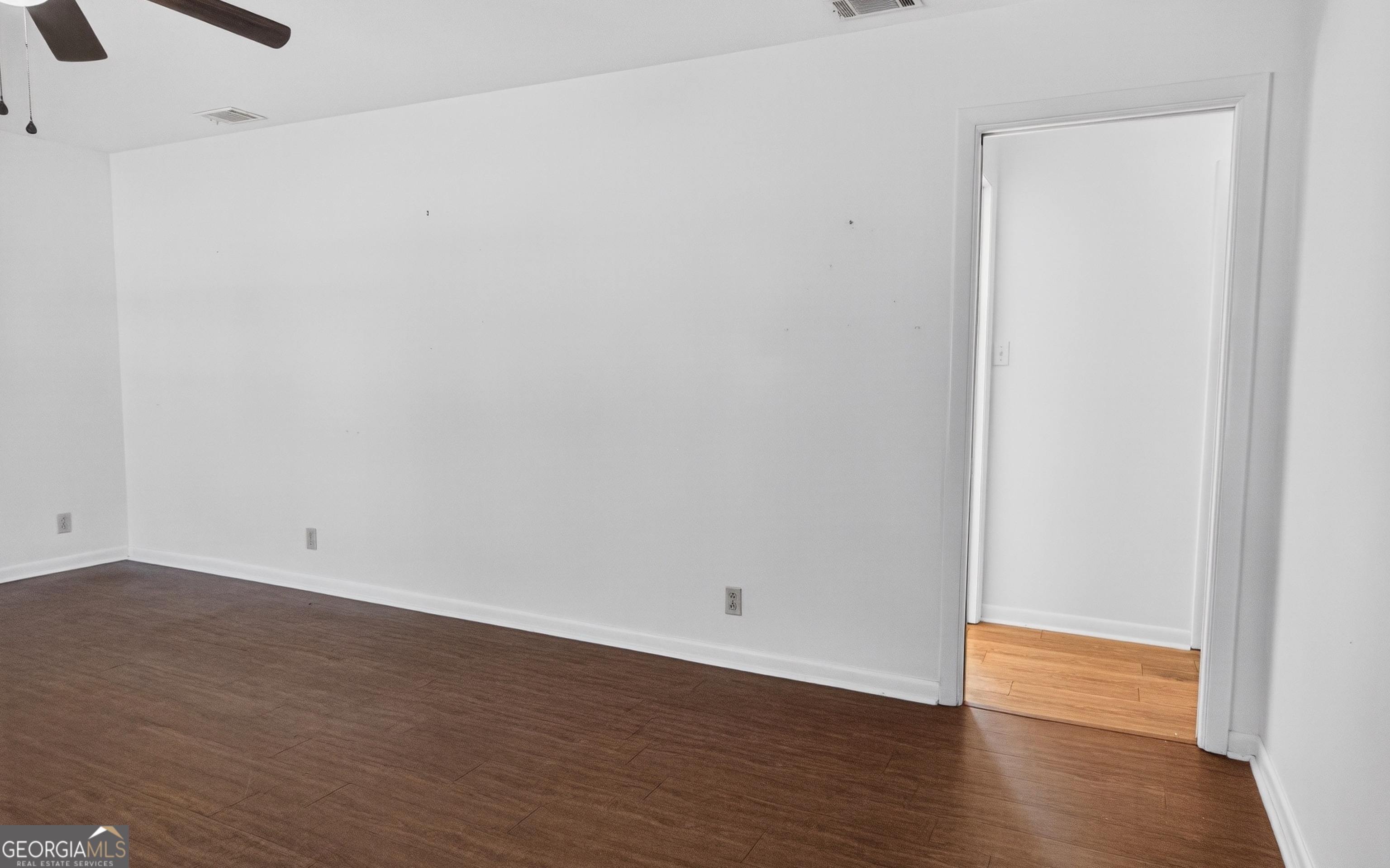 104 Azalea Lane Reidsville, GA 30453 - Photo 22 of 50 a view of an empty room with wooden floor