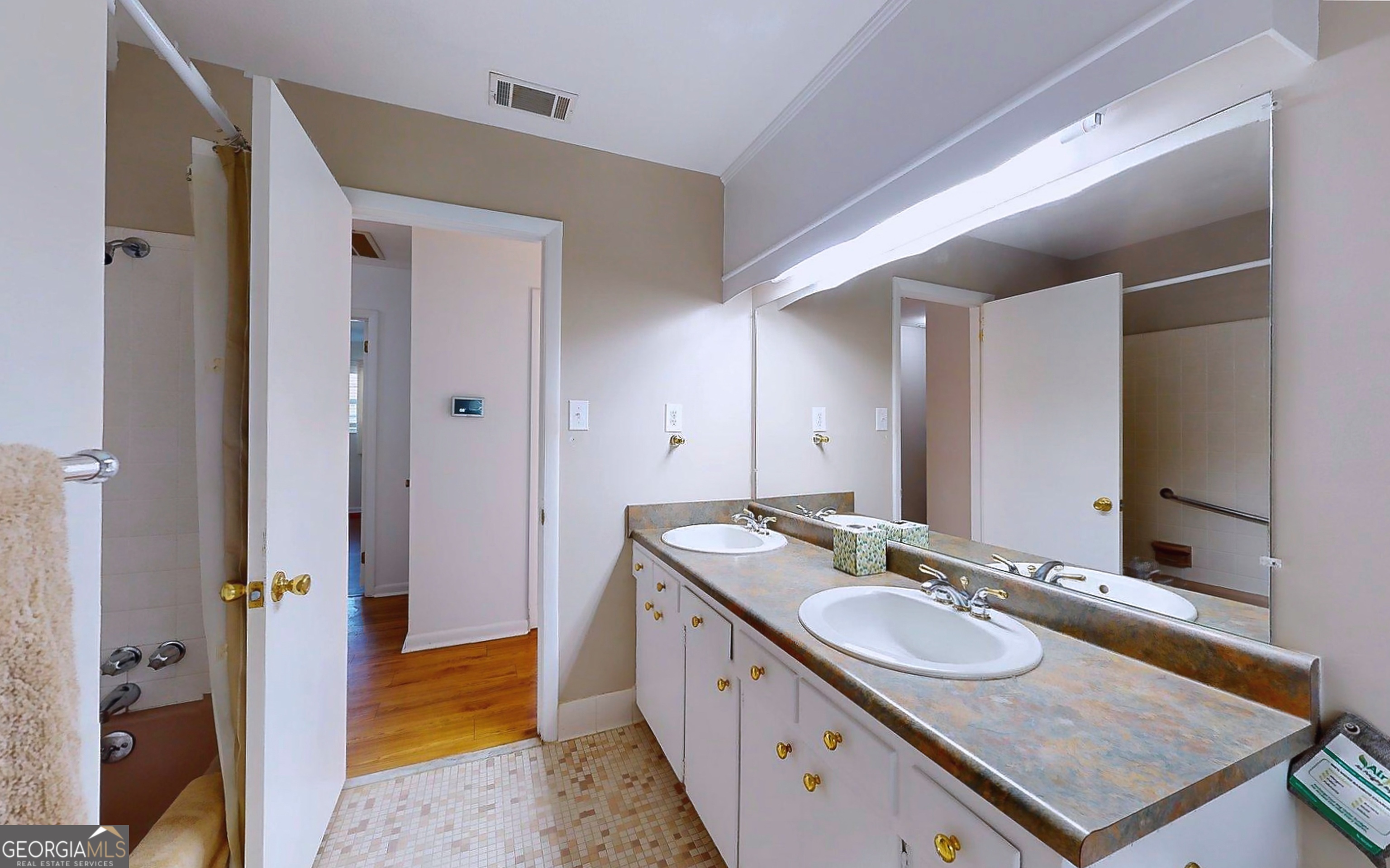 104 Azalea Lane Reidsville, GA 30453 - Photo 29 of 50 a bathroom with a granite countertop sink and a mirror