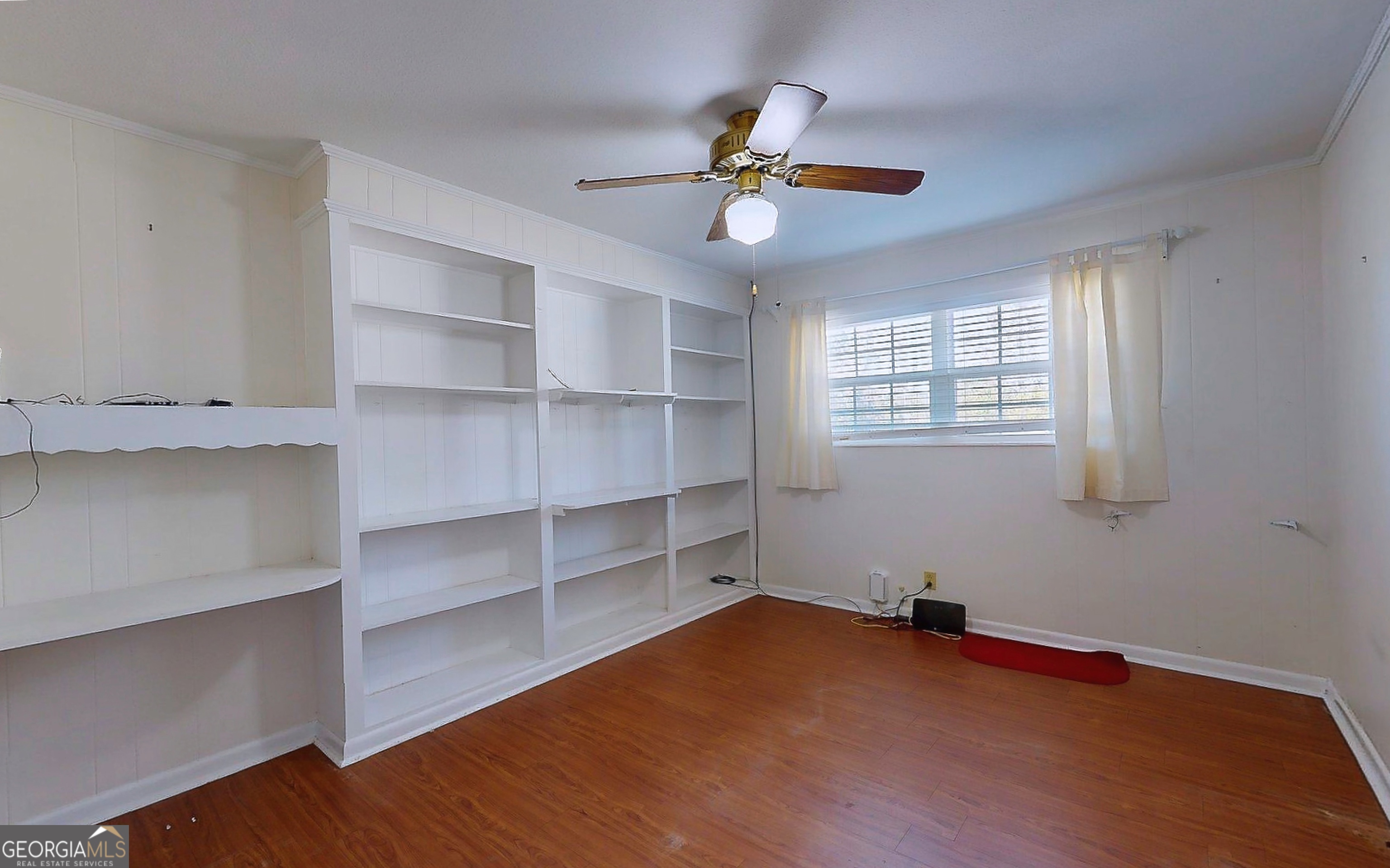104 Azalea Lane Reidsville, GA 30453 - Photo 34 of 50 a view of a room with wooden floor and cabinet