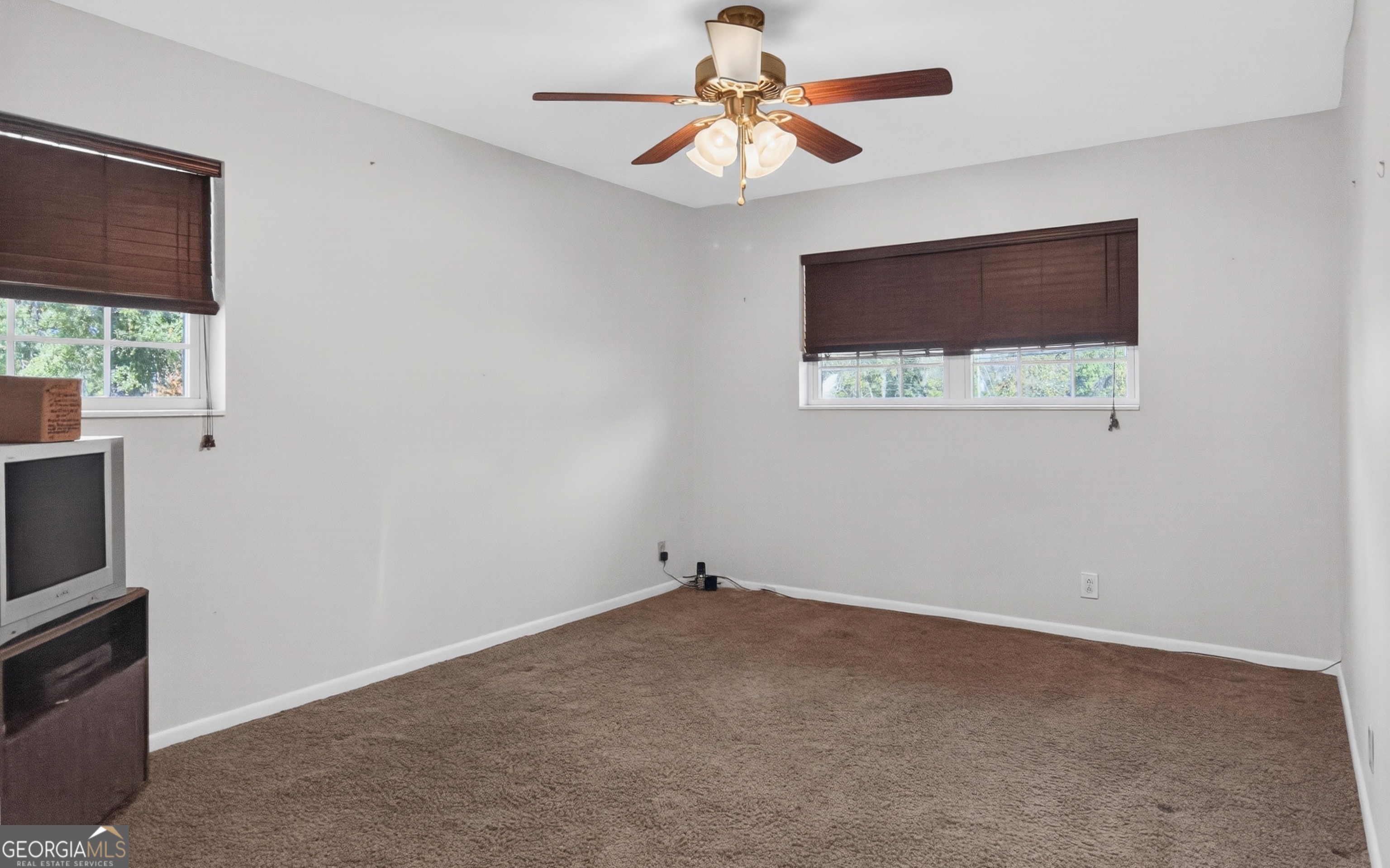 104 Azalea Lane Reidsville, GA 30453 - Photo 36 of 50 a view of room with a ceiling fan and a window