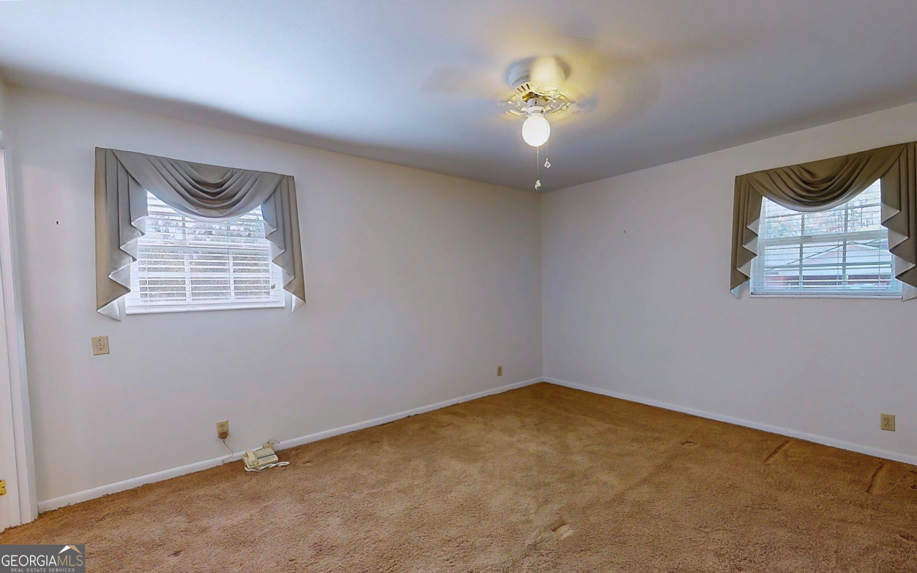 104 Azalea Lane Reidsville, GA 30453 - Photo 41 of 50 an empty room with a window