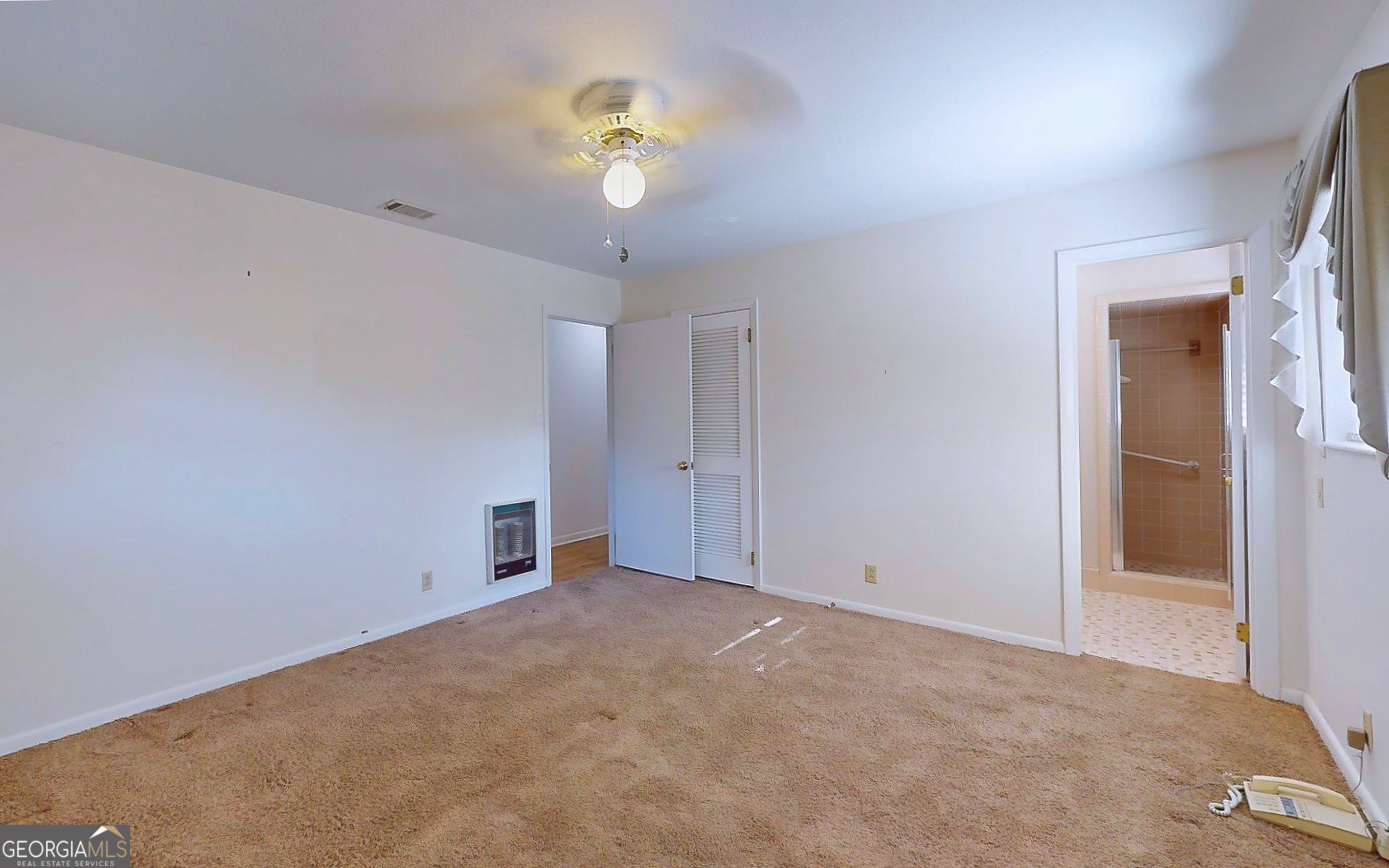 104 Azalea Lane Reidsville, GA 30453 - Photo 42 of 50 a view of an empty room with a window
