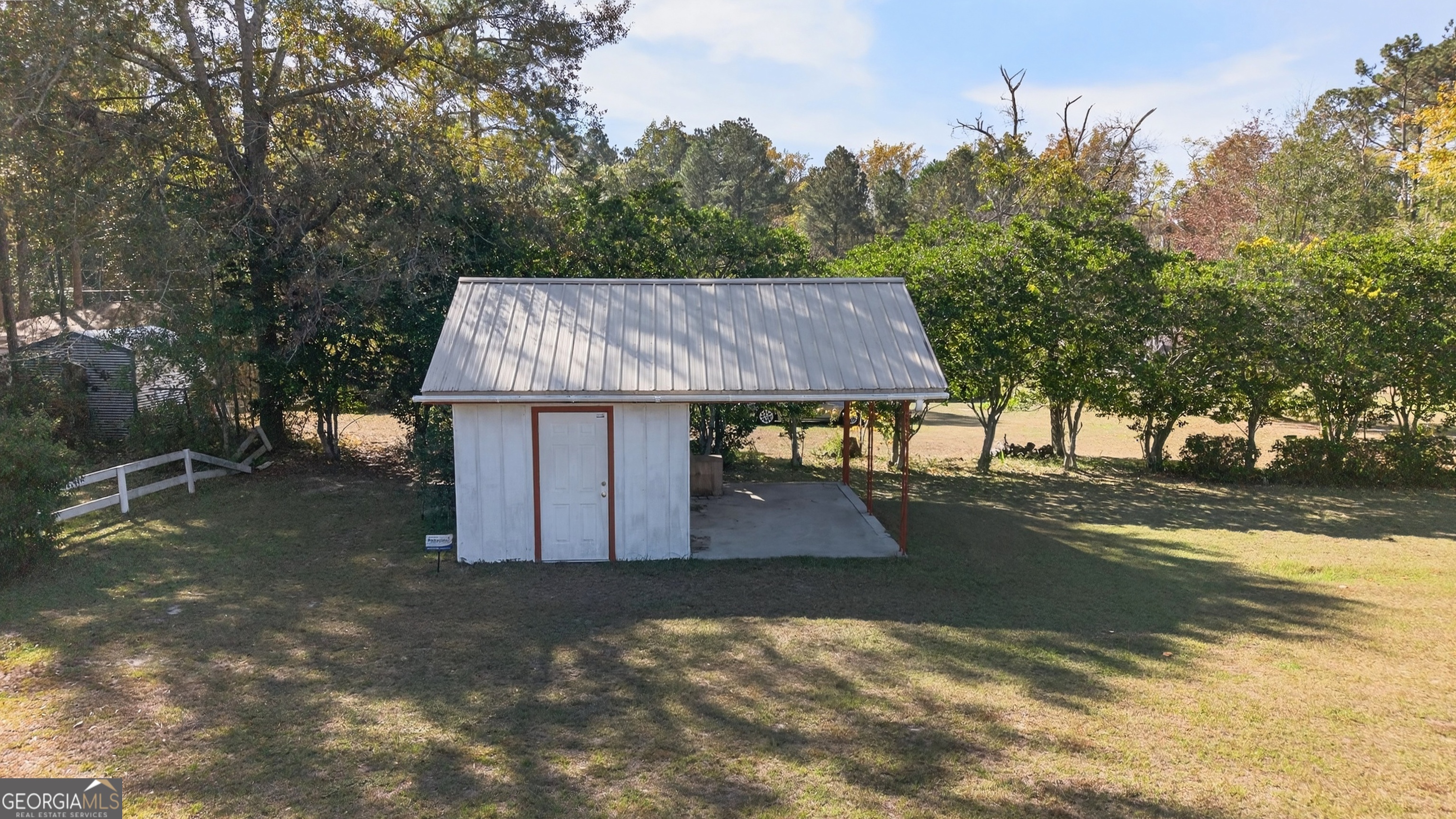 104 Azalea Lane Reidsville, GA 30453 - Photo 7 of 50 a view of a house with backyard and trees