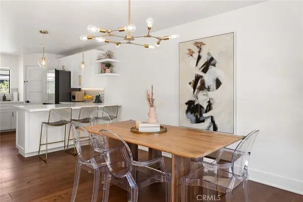 a bedroom with furniture and a chandelier