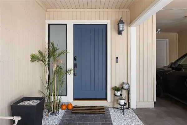 a view of a chairs and table on the wooden deck