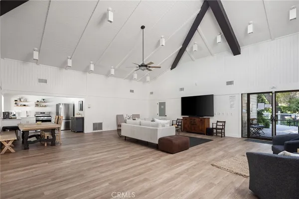 a room with gym equipment and windows