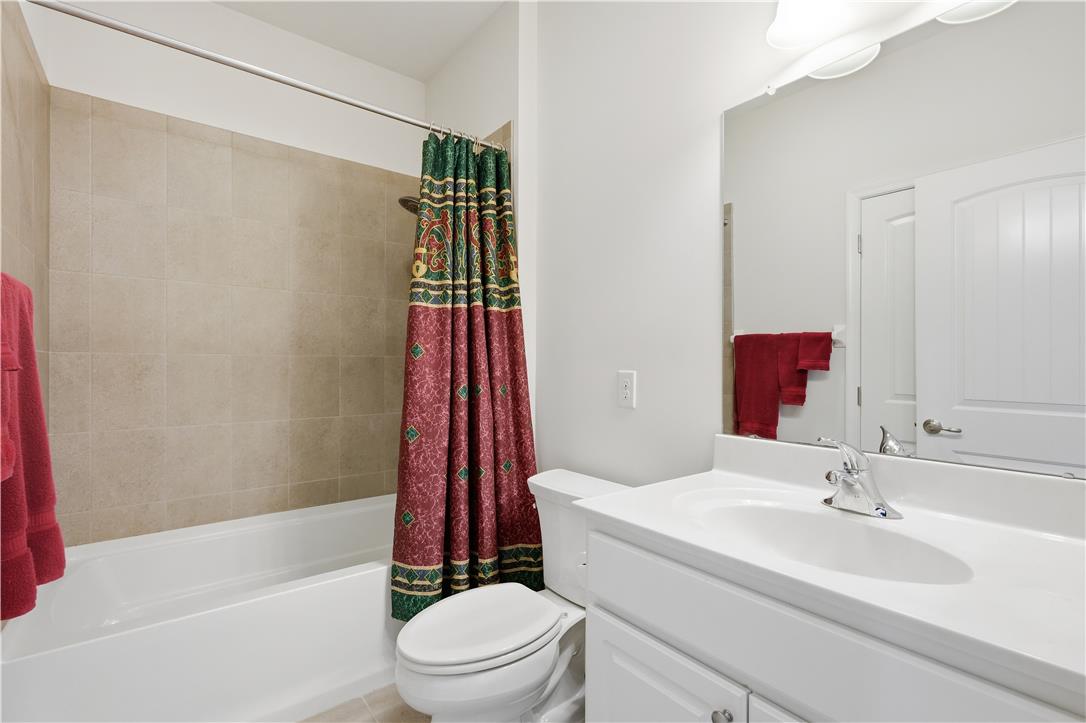 4120 Eveningstar Road Emmaus, PA 18049 - Photo 36 of 62 A pristine full bathroom with a spacious tub and well-maintained tile surround offers convenience.