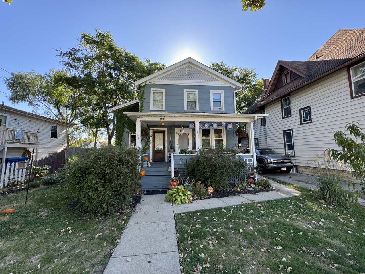 a front view of house with yard and trees