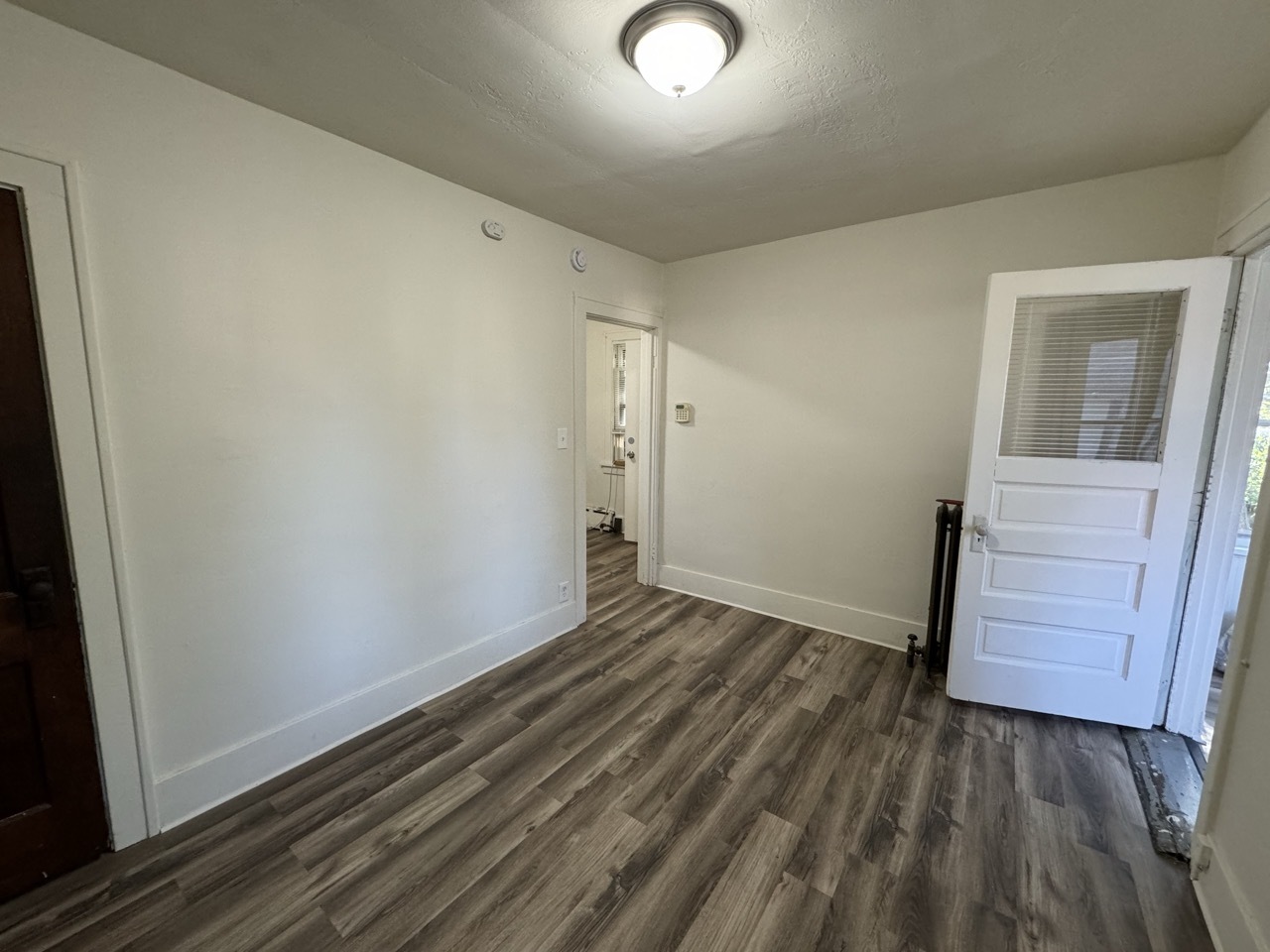 159 North 4th Street, Unit 3 Aurora, IL 60505 - Photo 5 of 12 an empty room with wooden floor