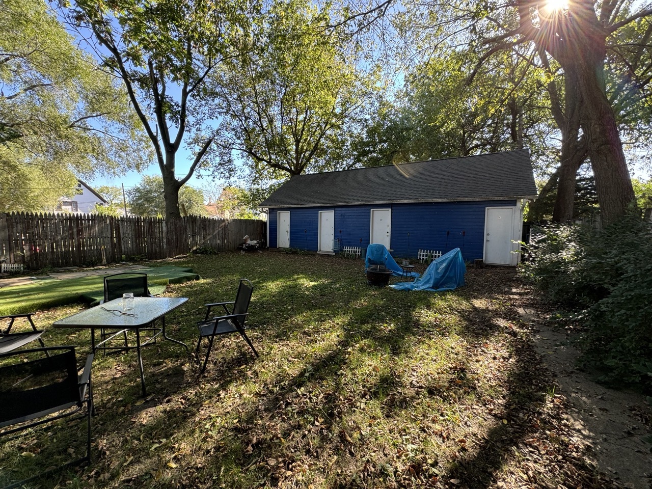 159 North 4th Street, Unit 3 Aurora, IL 60505 - Photo 9 of 12 a view of a yard with furniture and a tree