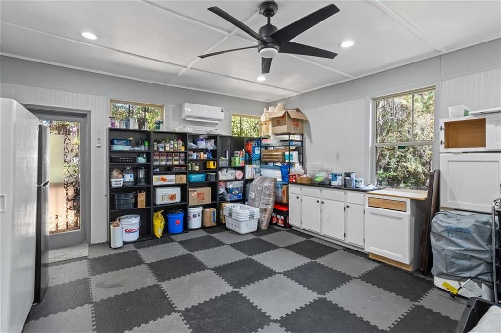 564 Eskew Road McDonough, GA 30252 - Photo 11 of 54 a very nice looking room with a large window and gym equipment