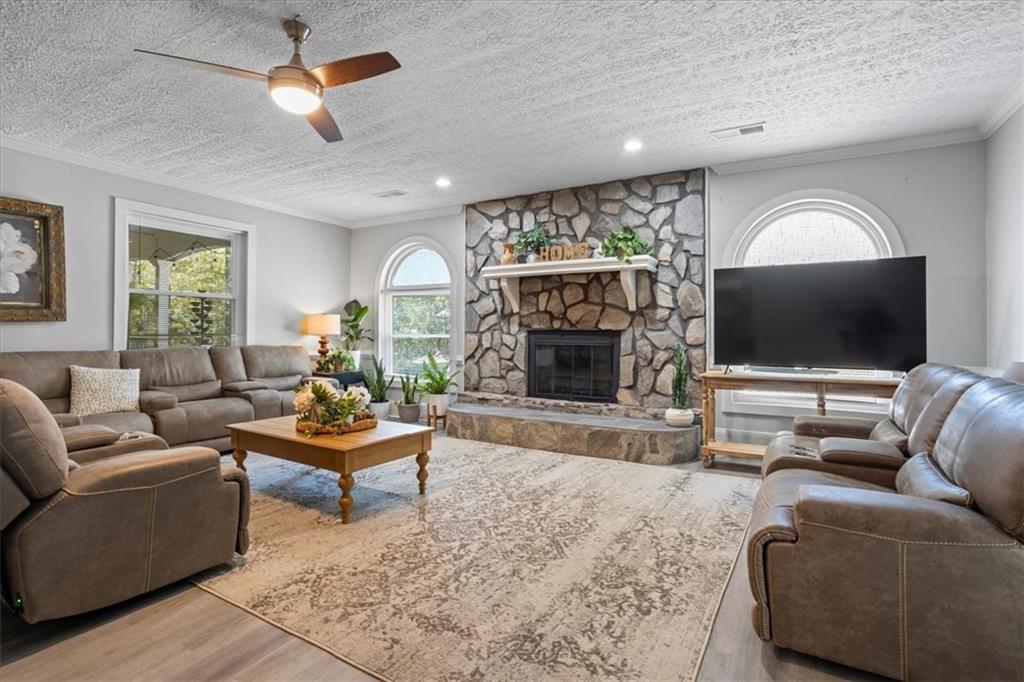 564 Eskew Road McDonough, GA 30252 - Photo 13 of 54 a living room with furniture and a flat screen tv