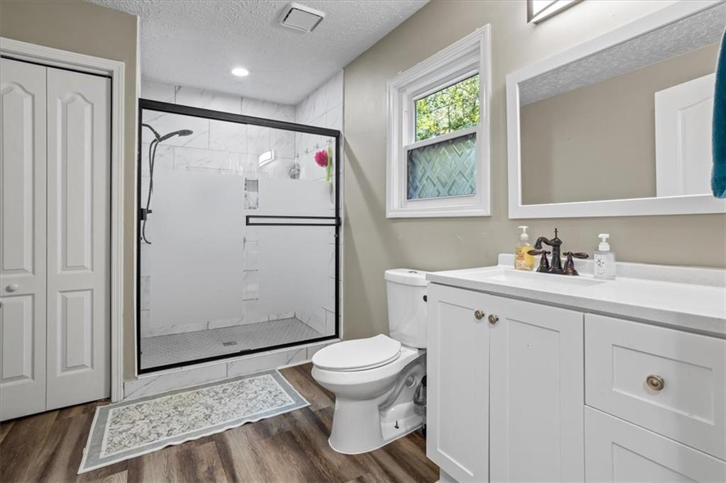 564 Eskew Road McDonough, GA 30252 - Photo 24 of 54 a bathroom with a sink toilet and shower