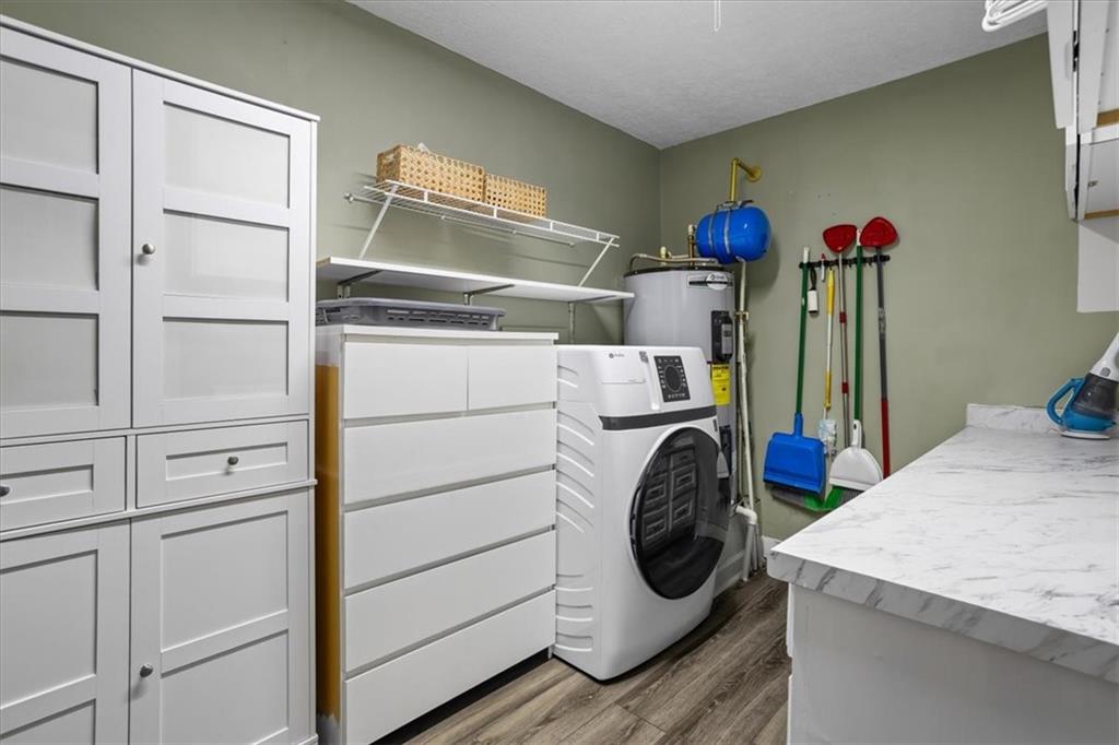 564 Eskew Road McDonough, GA 30252 - Photo 30 of 54 a utility room with dryer and washer