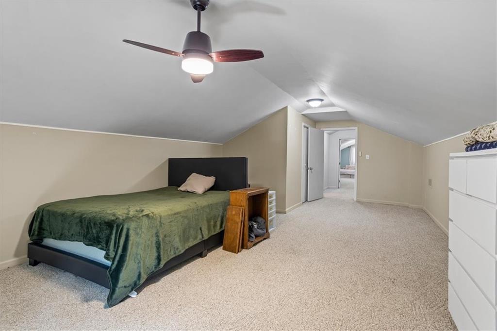 564 Eskew Road McDonough, GA 30252 - Photo 31 of 54 a bedroom with a bed and ceiling fan