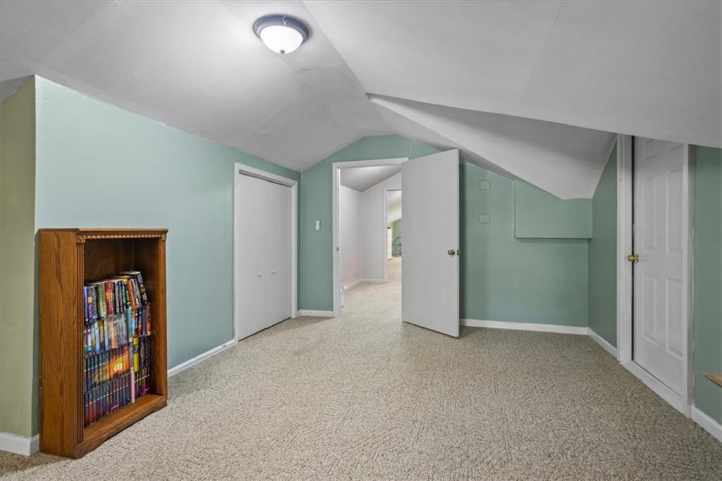 564 Eskew Road McDonough, GA 30252 - Photo 34 of 54 an empty room with closet and a hallway