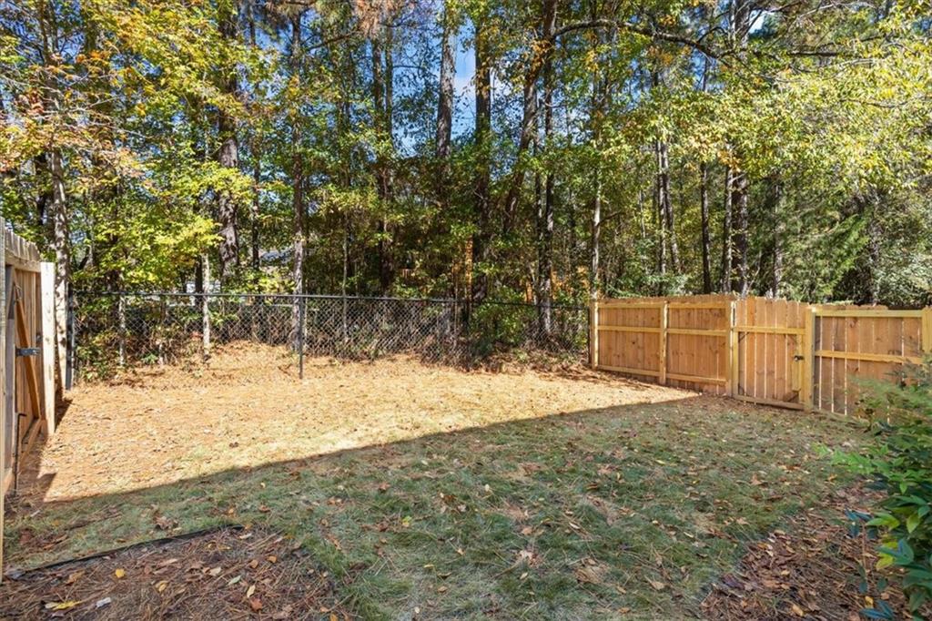 564 Eskew Road McDonough, GA 30252 - Photo 36 of 54 a view of a yard with large trees