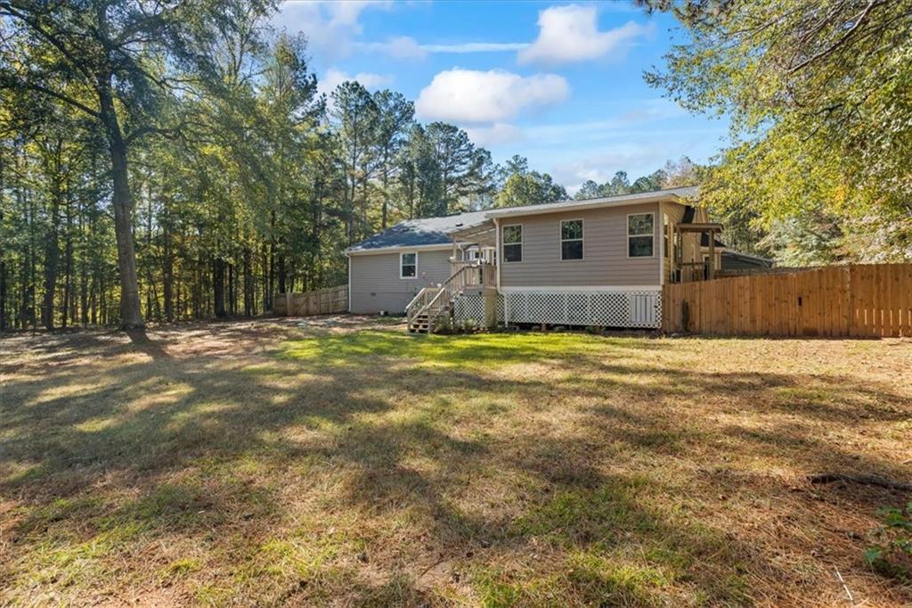 564 Eskew Road McDonough, GA 30252 - Photo 40 of 54 a view of a house with a yard
