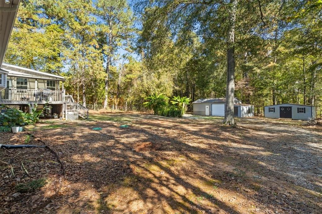 564 Eskew Road McDonough, GA 30252 - Photo 41 of 54 a front view of a house with a yard and trees