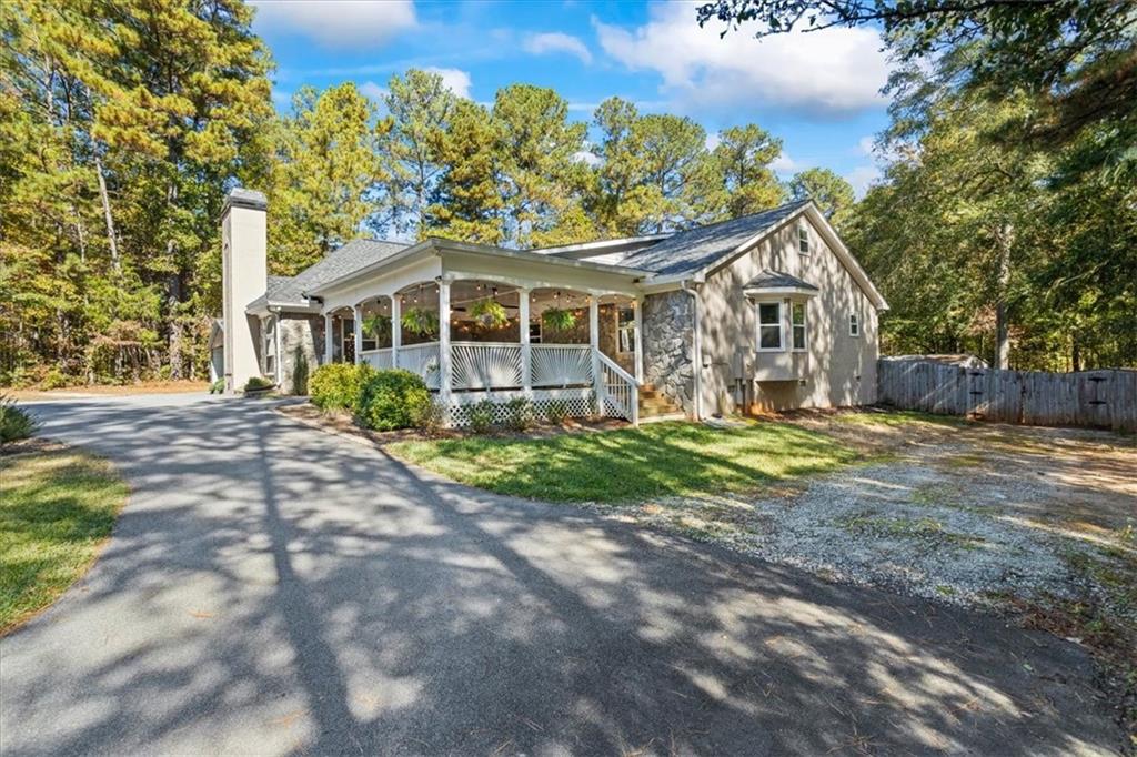 564 Eskew Road McDonough, GA 30252 - Photo 46 of 54 a front view of a house with a yard and trees