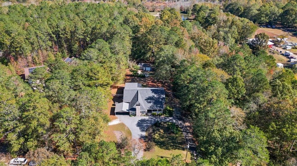 564 Eskew Road McDonough, GA 30252 - Photo 50 of 54 an aerial view of residential house with outdoor space and trees all around