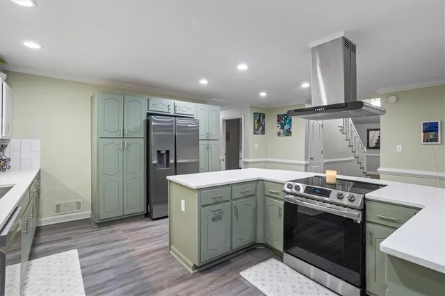 a kitchen with a stove and a refrigerator