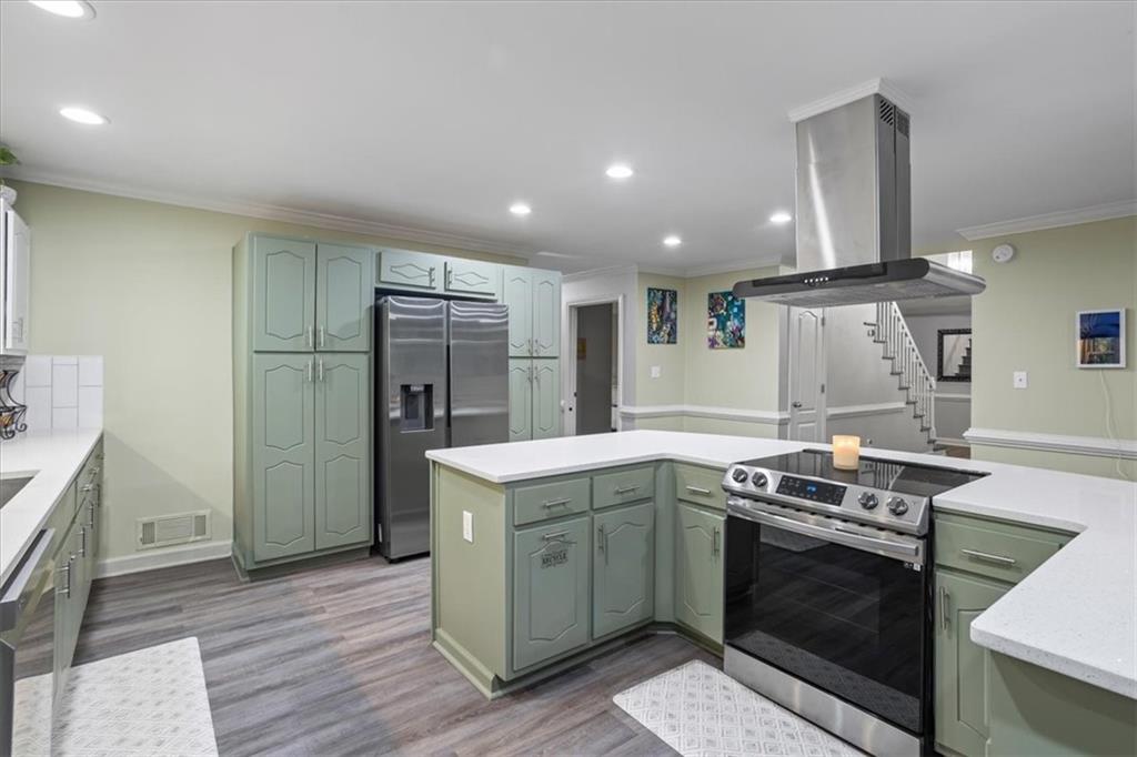 564 Eskew Road McDonough, GA 30252 - Photo 8 of 54 a kitchen with a stove and a refrigerator