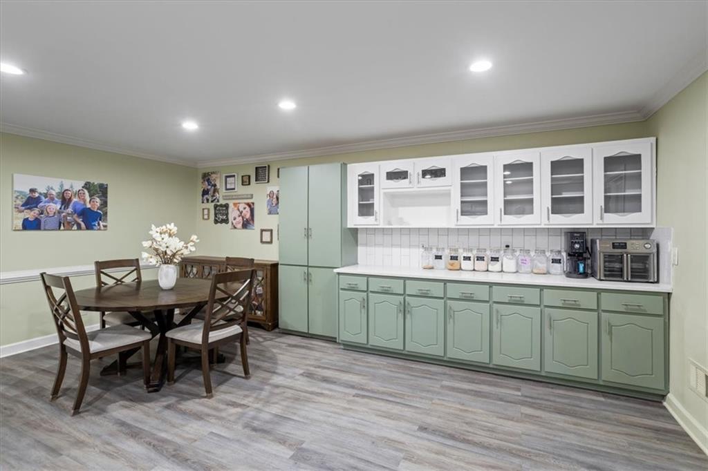 564 Eskew Road McDonough, GA 30252 - Photo 9 of 54 a view of a dining room with furniture and wooden floor