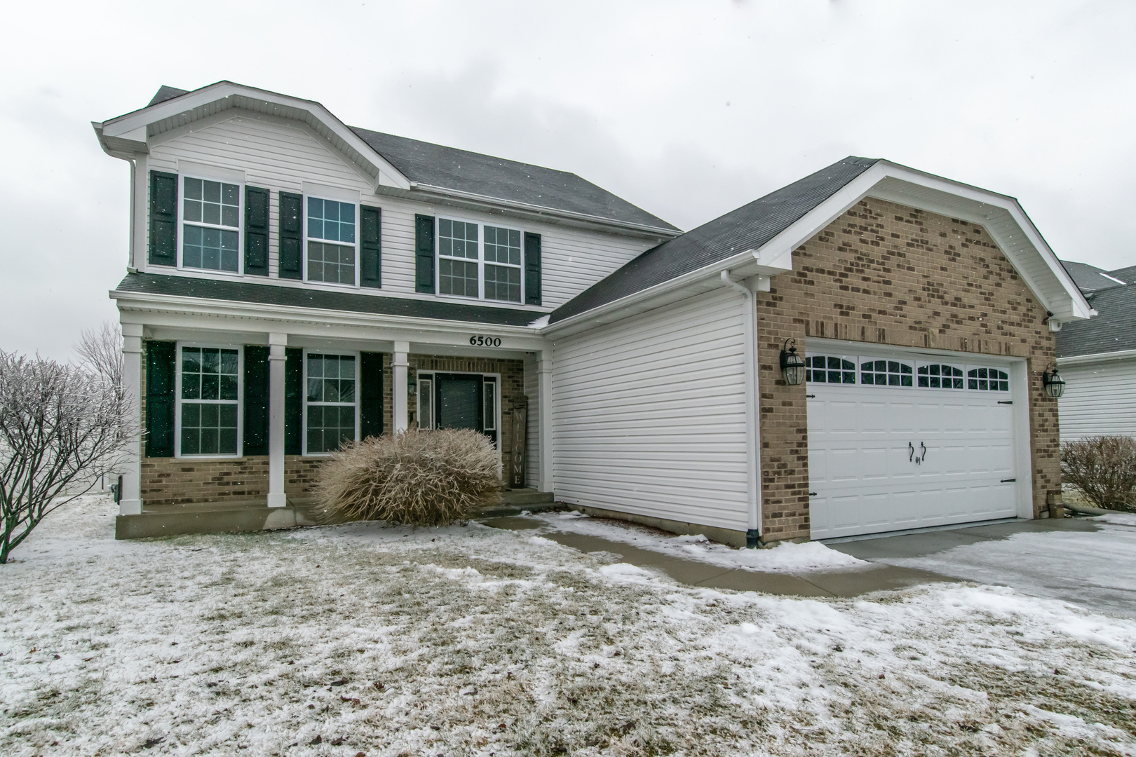 6500 Roth Drive Joliet, IL 60431 - Photo 1 of 36 a front view of a house with a garden