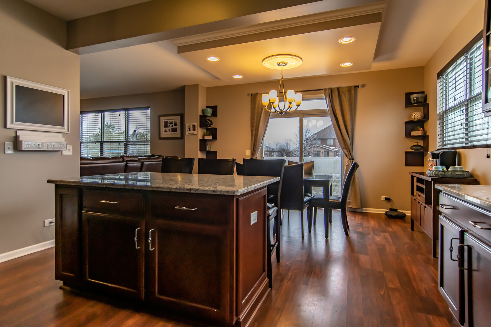 6500 Roth Drive Joliet, IL 60431 - Photo 14 of 36 a kitchen with a table chairs and wooden floor