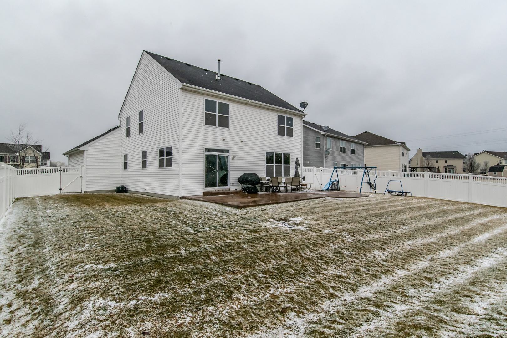 6500 Roth Drive Joliet, IL 60431 - Photo 5 of 36 a view of a white house with a yard