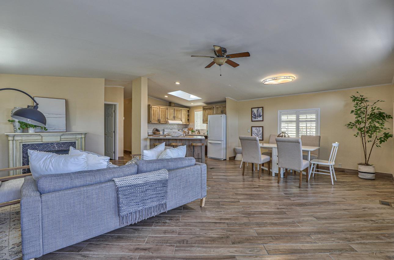 20 Russell Road, Unit 131 Salinas, CA 93906 - Photo 2 of 9 a living room with furniture wooden floor and a rug
