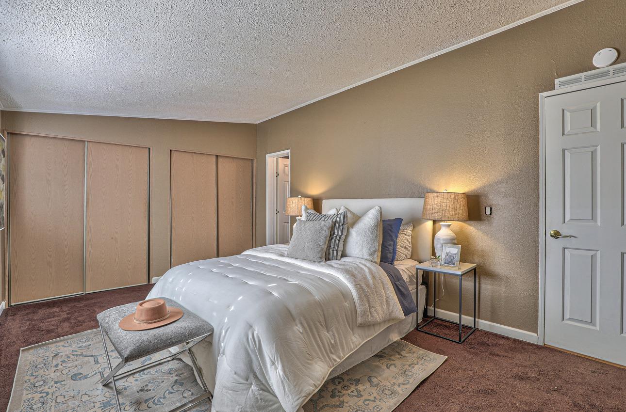 20 Russell Road, Unit 131 Salinas, CA 93906 - Photo 6 of 9 a bedroom with a bed and a lamp